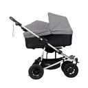Mountain-Buggy-duet-buggy-with-single-silver-carrycot-plus-in-lie-flat-mode-side-view.webp