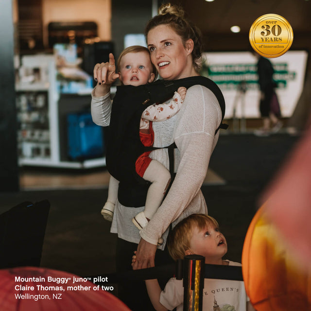 mum carrying child in juno™ carrier pack using parent facing position - Mountain Buggy juno™ pilot Claire Thomas, mother of two, Wellington, New Zealand