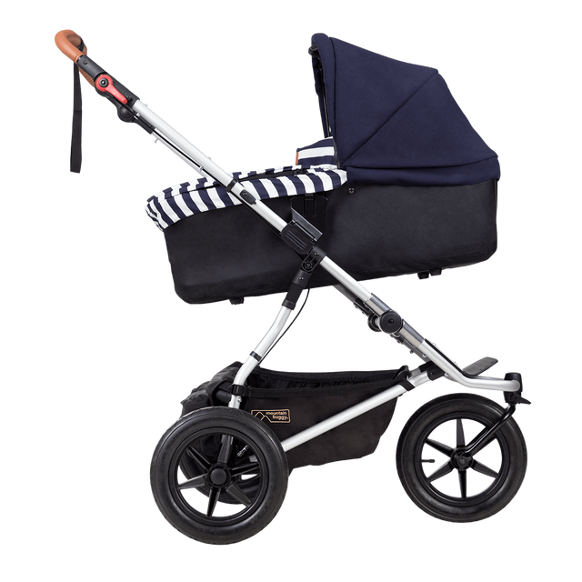 Mountain Buggy carrycot plus on urban jungle buggy in incline mode in colour nautical_nautical