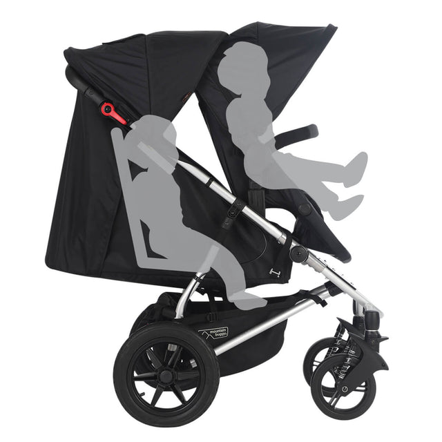 mountain buggy cosmopolitan plus side view showing toddler in sling seat and todder in modular seat - fabric colour_black