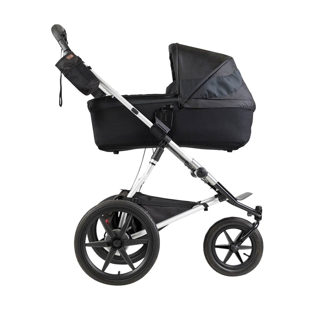 Mountain Buggy carrycot plus on terrain in lie flat mode in colour onyx_onyx