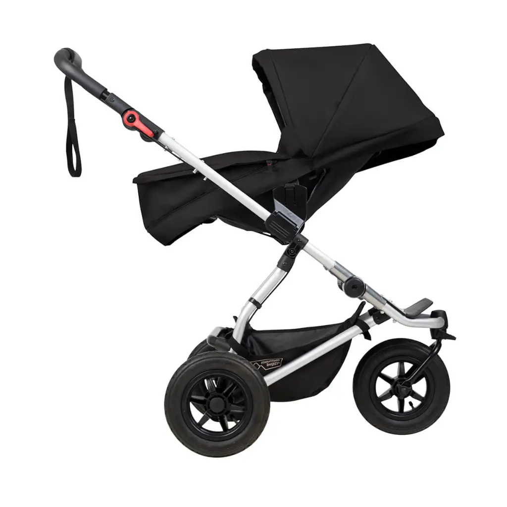 Mountain-Buggy-black-carrycot-plus-on-swift-buggy-in-parent-facing-mode-side-view.webp